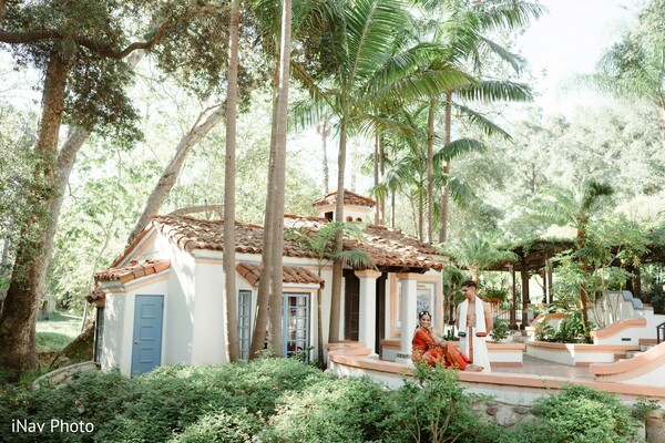 spanish-style venue,palm tree wedding,tropical wedding location,rustic outdoor venue,wedding garden,historic architecture,destination wedding,cultural wedding venue,serene outdoor setting,south asian wedding vibes
