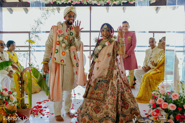 wedding ceremony,bride and groom,traditional attire,floral mandap,south asian wedding,cultural rituals,vibrant outfits,ceremony portraits,hindu wedding,wedding details