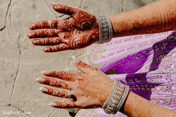 bridal mehndi,henna design,silver bangles,bridal details,south asian bride,mehndi closeup,lavender lehenga,wedding traditions,hand jewelry,wedding portrait details