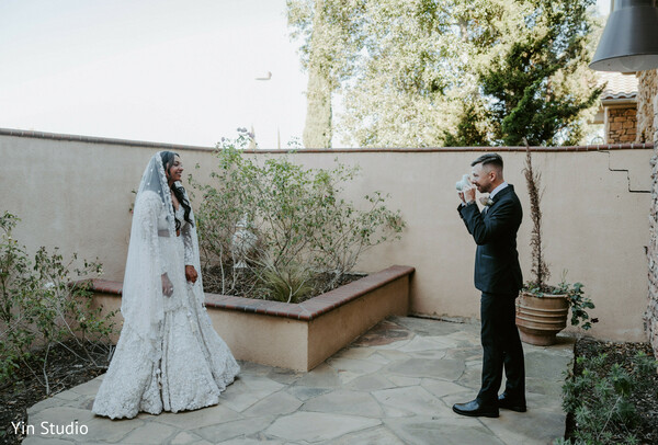 wedding details,couple hands,bridal jewelry,groom’s sherwani,close-up romance,elegant details,love captured,symbolic shot,cultural rings,timeless bond