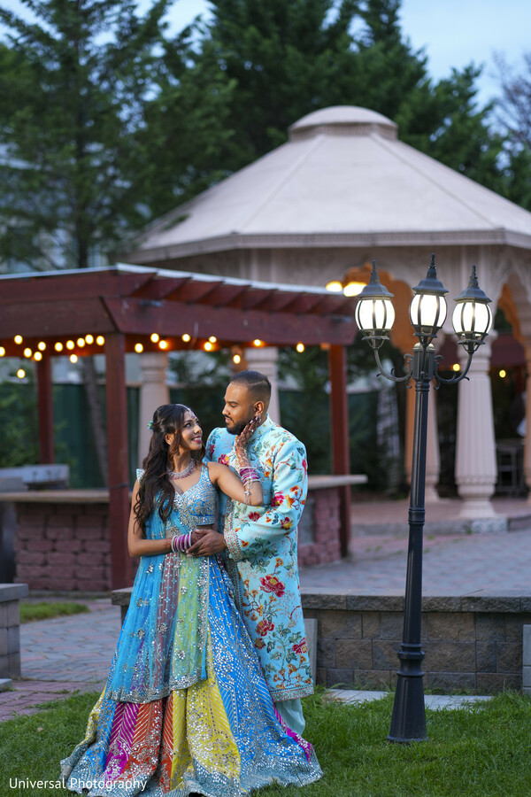evening romance,gazebo wedding photo,outdoor couple portrait,twinkle lights,indian wedding couple,night portrait,romantic embrace,dreamy love,intimate moment,wedding photography magic