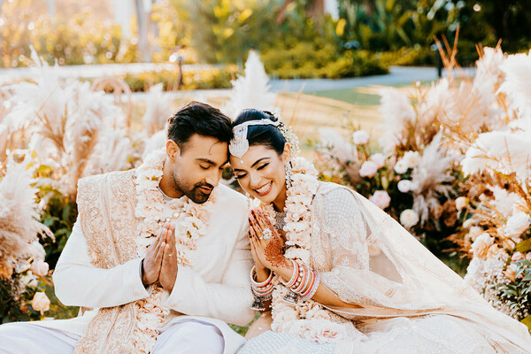 sunset portraits,pampas decor,outdoor shoot,couple session,romantic moment,boho wedding,elegant tones,natural light,dreamy couple,love story