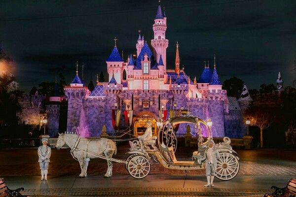 castle backdrop,fairytale wedding,horse carriage,disney magic,royal celebration,evening glow,destination wedding,dreamlike scene,romantic fairytale,enchanted moment