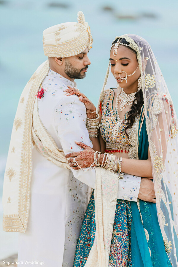western wedding,white gown bride,mint suit groom,floral arch,multicultural wedding,romantic portraits,elegant decor,south asian bride,henna and lace,modern wedding couple