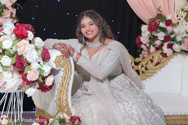 floral arch,ceremony setup,red and blush roses,luxury wedding decor,indian fusion wedding,grand wedding aisle,romantic floral design,elegant mandap,south asian ceremony,venue inspiration