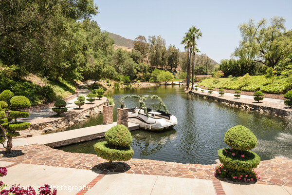 wedding venue,garden lake,outdoor ceremony site,elegant landscape,destination wedding,water reflections,floral details,south asian luxury wedding,nature beauty,venue highlight