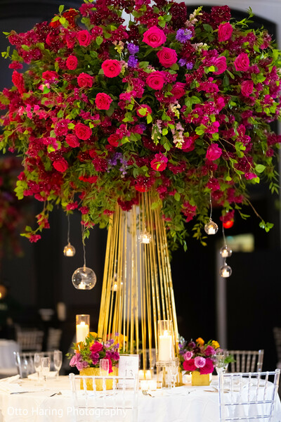 reception centerpiece,red florals,tall arrangement,luxury decor,ballroom reception,romantic ambiance,gold stands,event styling,floral &amp; decor,south asian wedding