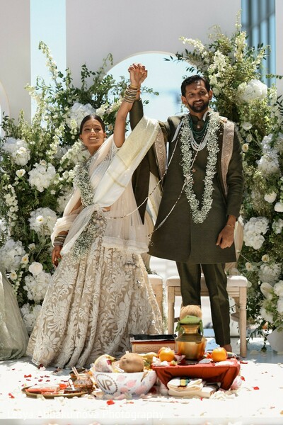 wedding celebration,south asian couple,ceremony joy,mandap florals,just married moment,wedding portraits