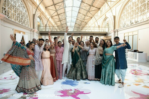 sangeet celebration,wedding party,south asian fashion,prewedding event,group celebration,vibrant wedding moments