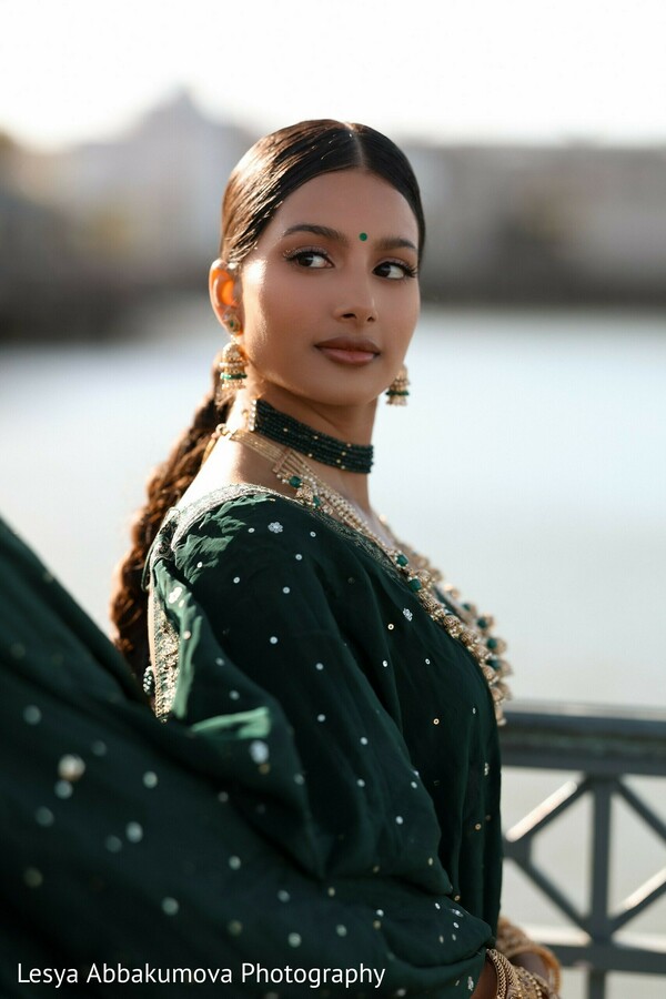 stunning south asian bride,green bridal outfit,bridal portraits,indian wedding style,traditional jewelry,outdoor bridal shoot,elegant bridal look