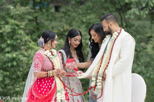hindu wedding ritual,family blessings,south asian ceremony,varmala moment,cultural traditions,indian couple,sacred rituals,wedding memories,desi heritage,knot-tying ritual