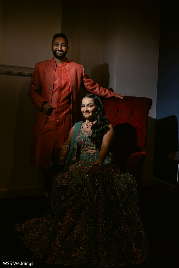 south asian couple,pre-wedding portraits,sherwani and lehenga,dramatic lighting photo,couture indian fashion,elegant couple portrait,intimate wedding moment,luxury south asian wedding,traditional attire highlights,indoor wedding portraits