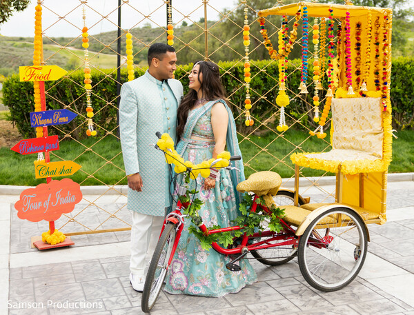 prewedding shoot,indian prewedding decor,rickshaw decor,marigold strings,vibrant wedding setup,south asian couple portraits,mehndi sangeet inspiration,playful wedding details