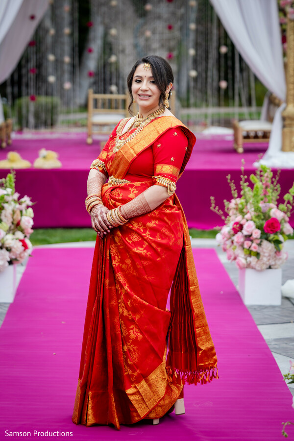 red bridal saree,south indian bride,traditional bridal portrait,gold temple jewelry,indian wedding attire,silk saree bride,wedding portrait inspiration