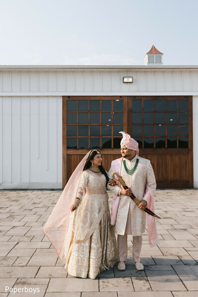 south asian wedding couple,outdoor wedding portraits,bride and groom walk,romantic indian wedding,wedding day portraits