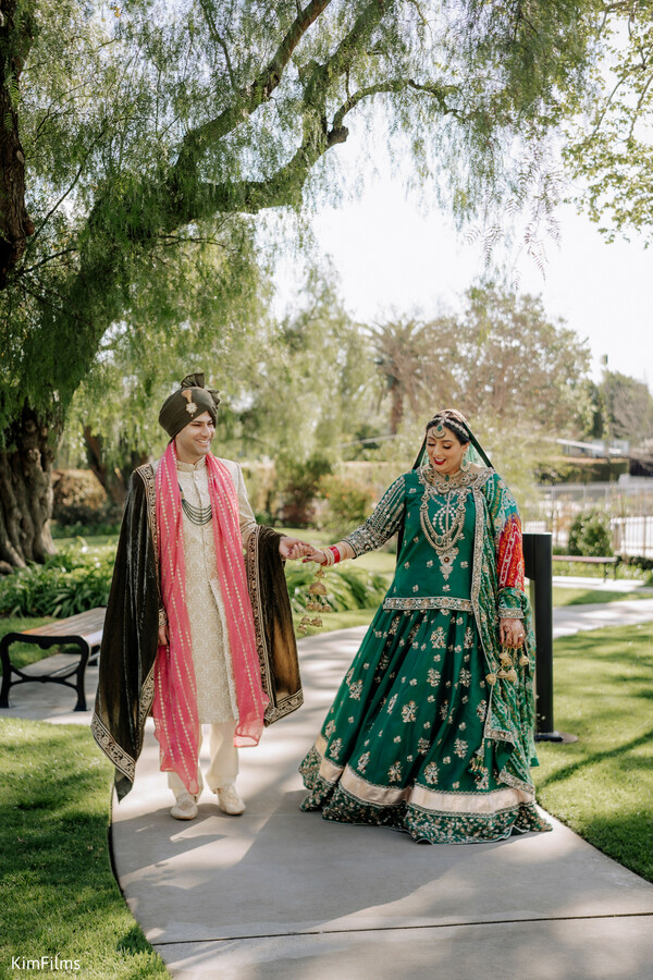south asian wedding,indian bride and groom,elegant indian wedding,lehenga and sherwani,wedding portraits,outdoor wedding ceremony,luxury indian wedding