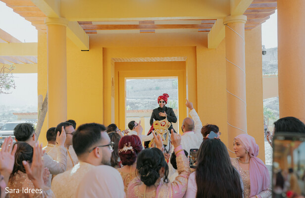 wedding celebration lift,groom lifted tradition,joyful wedding crowd,indian wedding baraat vibes,candid wedding joy,festive wedding moment,guest celebration energy,cultural wedding traditions,lively wedding atmosphere,family celebration