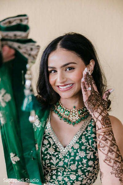 bridal portrait,mehndi design,green bridal lehenga,south asian bride,bridal jewelry,choker necklace,henna art,pre wedding glow,cultural beauty,festive elegance