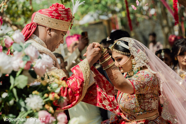 indian wedding ceremony,sacred wedding rituals,bride and groom moment,pheras ceremony,floral blessings,traditional vows,south asian wedding emotions,ritual photography,ceremonial details,wedding unity