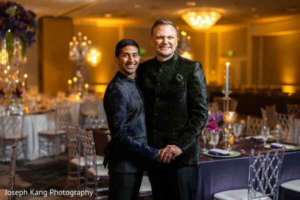black sherwani groom,reception portraits,elegant wedding attire,luxury wedding reception,candlelit wedding decor,modern south asian wedding,romantic couple portrait,evening wedding elegance,fusion wedding style