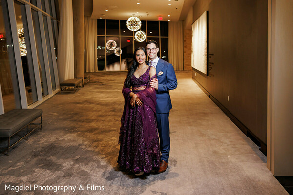 reception couple portrait,evening wedding attire,indoor night portrait,romantic hallway photo,wedding glamour,elegant couple styling,south asian wedding reception,modern love story,luxury wedding photography,end of night portrait
