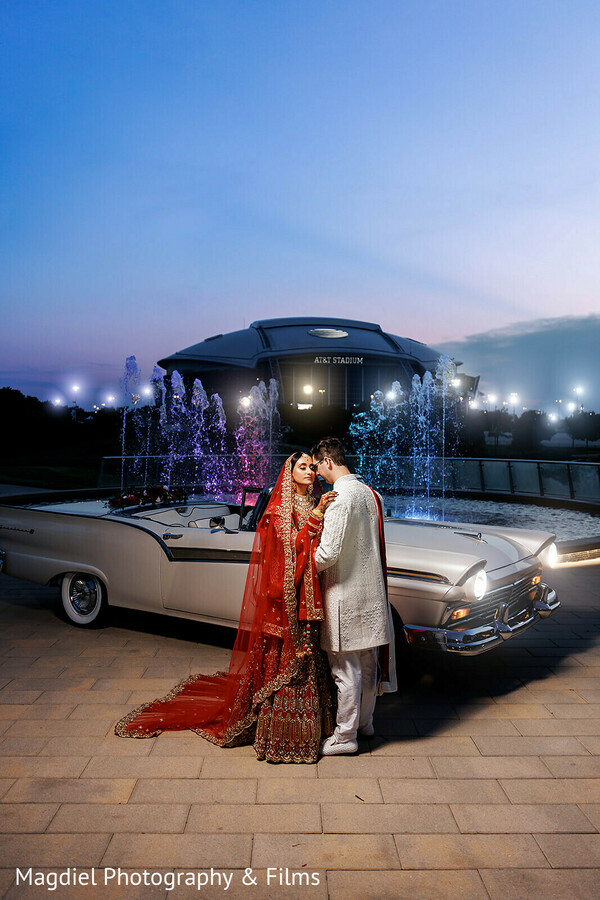 night wedding portrait,vintage wedding car,red bridal veil,fountain wedding photo,dramatic couple portrait,luxury wedding vibe,outdoor night wedding,indian bride groom,cinematic wedding photography,modern indian wedding