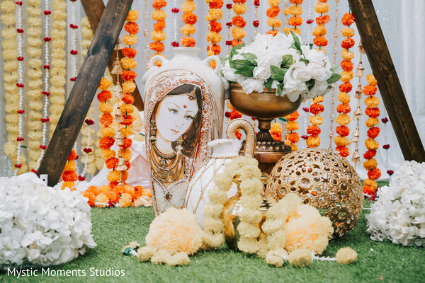 haldi ceremony decor,marigold garlands,brass wedding decor,traditional indian wedding setup,floral haldi backdrop,pre-wedding styling,yellow wedding theme,cultural wedding details,festive indian decor,south asian ceremony design