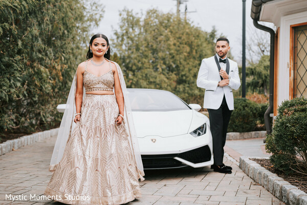 luxury wedding portrait,champagne lehenga,white tux groom,sports car wedding photo,modern indian wedding,glamorous bridal look,fashion-forward couple,reception outfit change,high-end wedding styling,contemporary wedding photography