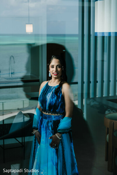 blue bridal lehenga,ocean view portrait,destination wedding photography,elegant bridal portrait,modern south asian bride,seaside wedding location,artistic wedding photography,bridal fashion inspiration,natural light portrait,luxury wedding style
