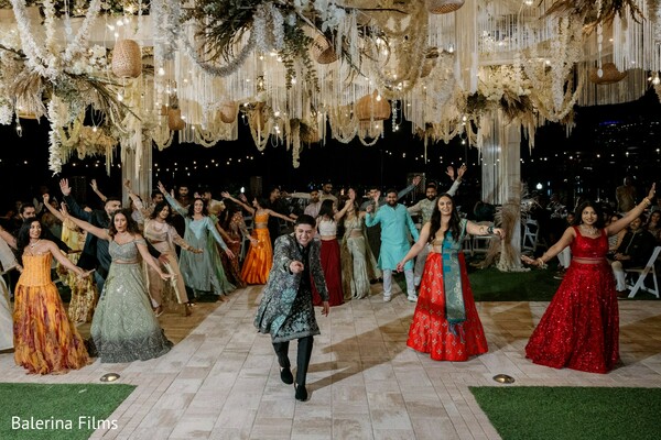 sangeet dance performance,wedding party dance floor,indian wedding sangeet night,luxury reception celebration,wedding entertainment performance,vibrant dance floor moment,south asian wedding celebration,festive wedding atmosphere,group dance performance,reception party energy