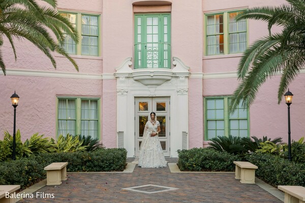 ivory bridal gown portrait,destination wedding venue,pastel architecture backdrop,elegant bridal portrait,south asian bride style,outdoor bridal fashion,luxury wedding venue,romantic bridal photography,garden wedding setting,timeless bridal elegance