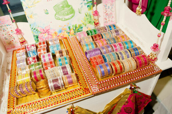 bridal bangles display,indian wedding jewelry details,colorful chooda bangles,wedding accessories flat lay,bridal preparation details,mehndi accessories,traditional indian jewelry,wedding detail shot,vibrant wedding elements,cultural wedding accessories