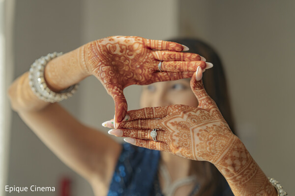 mehndi close up creative,bridal henna hands,engagement ring detail,indian wedding mehndi,artistic wedding shot,bridal accessories detail,henna patterns,wedding photography creative,bride hands framing face,cultural wedding detail