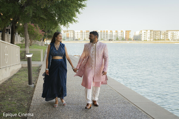 waterfront couple walk,pre-wedding shoot,engagement session,couple candid walking,lakeside romance,south asian couple,modern indian outfits,outdoor couple session,romantic stroll,love story photography
