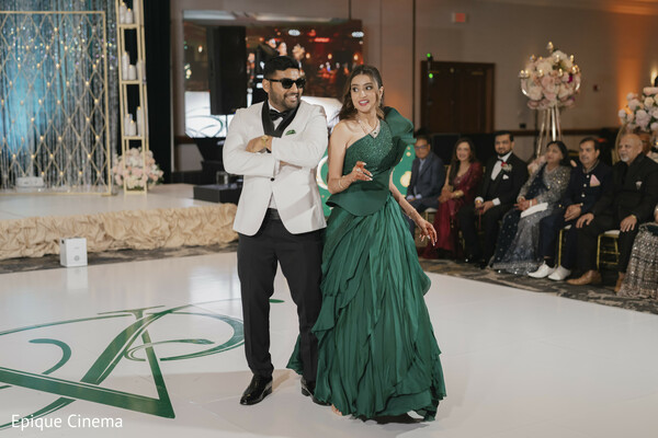 wedding reception dance,couple performance,first dance indian wedding,reception entertainment,bride green gown,groom tuxedo,dance floor moment,wedding celebration,party vibes wedding,modern wedding reception