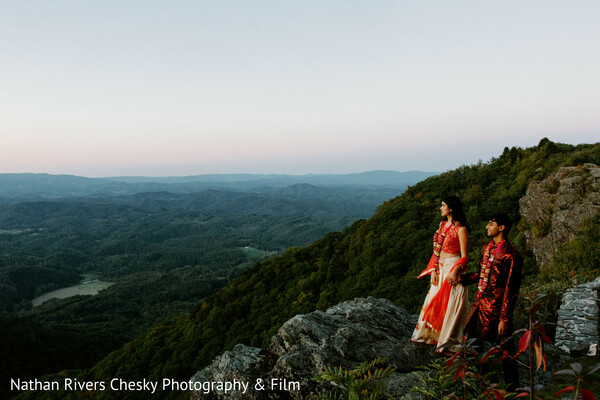 mountain couple portrait,scenic engagement shoot,destination wedding photography,romantic landscape,indian couple outdoors,nature wedding backdrop,cliffside portrait,pre wedding shoot,cinematic wedding photography,south asian couple