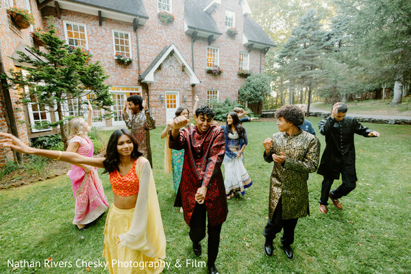 wedding party dance,outdoor celebration,sangeet performance,indian wedding guests,group dance moment,festive wedding vibe,colorful outfits,south asian wedding fun,pre wedding celebration,candid dance