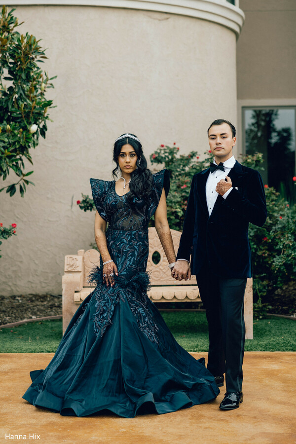 first dance wedding,mariachi band wedding,fusion wedding celebration,indoor reception dance,bride gown movement,romantic dance moment,wedding guests watching,cultural fusion wedding,joyful reception moment,live music wedding