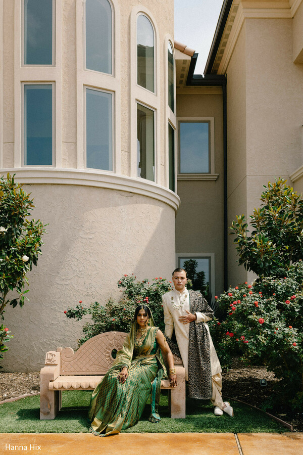 indian wedding portraits,bride seated pose,groom standing portrait,garden wedding backdrop,architectural wedding venue,green saree bride,editorial wedding photography,luxury wedding portrait,outdoor couple shoot,classic indian fashion