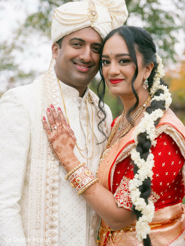 close up couple portrait,bridal mehndi details,groom sherwani cream,bride saree red white,indian wedding jewelry,intimate couple moment,bridal bangles,wedding portrait detail,cultural wedding,romantic expression