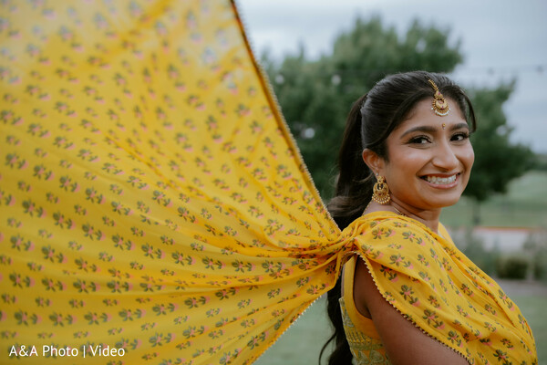 bride solo portrait,yellow dupatta flow,haldi outfit bride,bridal jewelry detail,candid bride smile,outdoor bridal shoot,indian bride portrait,vibrant pre wedding look,playful bridal moment,cultural attire detail
