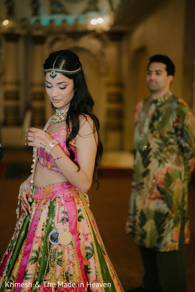 bride getting ready candid,groom background blurred,romantic pre wedding moment,bridal jewelry detail,lehenga fashion portrait,couple anticipation moment,soft focus photography,emotional wedding prep,indian wedding portrait,intimate candid