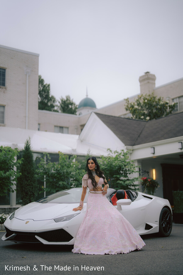 bride with luxury car,modern bridal portrait,lehenga fashion shoot,destination wedding glam,bridal attitude pose,fusion wedding style,editorial bridal photography,stylish bride moment,outdoor portrait luxury,contemporary indian bride