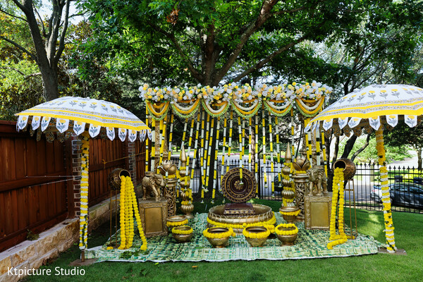 haldi decor setup,marigold wedding decor,indian pre wedding ceremony,floral backdrop yellow theme,traditional decor details,brass decor elements,outdoor haldi setup,cultural wedding decor,festive setup,wedding styling