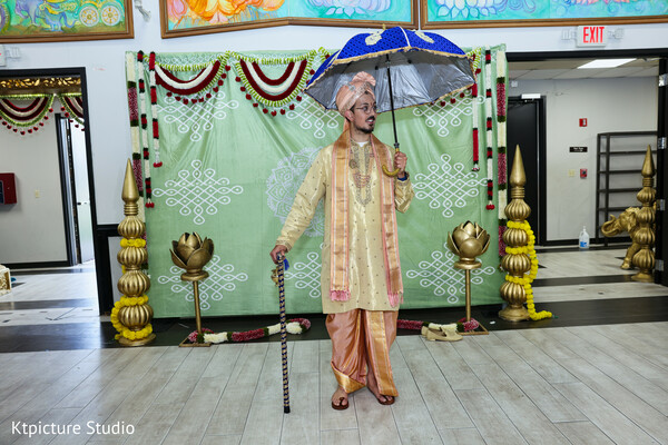 groom portrait traditional,groom sherwani look,indian groom accessories,wedding umbrella prop,groom solo portrait,pre ceremony style,cultural attire groom,playful wedding moment,baraat style inspiration,groom fashion