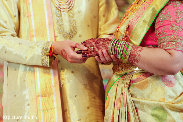 mehndi close up,bride henna hands,couple holding hands,wedding jewelry details,indian wedding rituals,colorful bangles bride,traditional wedding moment,intimate couple detail,cultural ceremony prep,bridal accessories