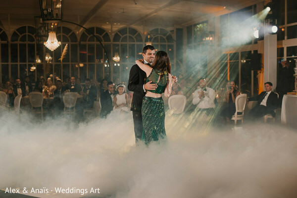 first dance,wedding reception,couple dancing,romantic dance,fog effect,luxury wedding,dance floor,evening wedding,bride and groom,magical moment
