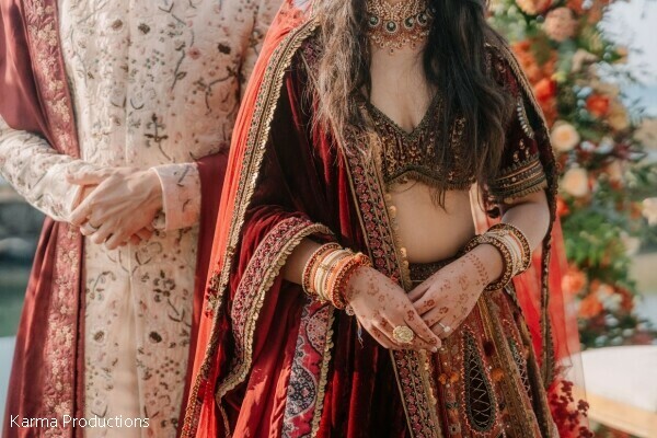 bridal fashion,velvet lehenga,embroidered sherwani,bridal jewelry,mehndi details,wedding attire,burgundy bridal wear,luxury wedding fashion,couple details,south asian bride