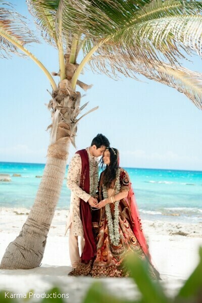 beach portraits,palm trees,destination wedding,romantic couple,ocean views,tropical romance,bride and groom,coastal wedding,intimate moments,luxury destination wedding