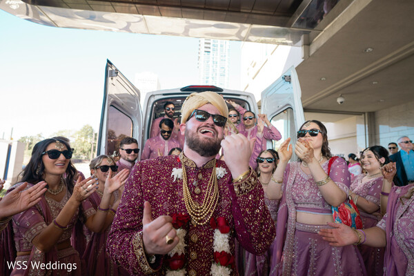 baraat,groom entrance,wedding procession,dancing groom,wedding guests,cultural traditions,celebration,destination wedding,festive moments,south asian wedding